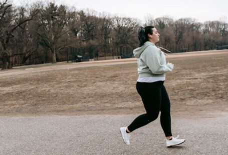 Born To Run - Plus size woman running in autumn park