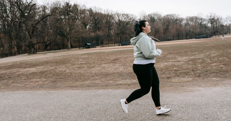 Born To Run - Plus size woman running in autumn park