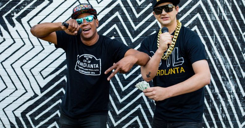 Atlanta - Two People Wearing Black Shirts Standing Near Wall