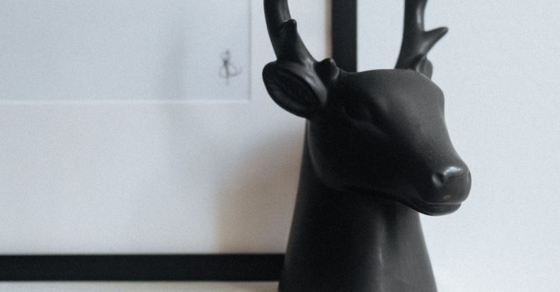 Dear Evan Hansen - Statue of stag head on shelf in bright room