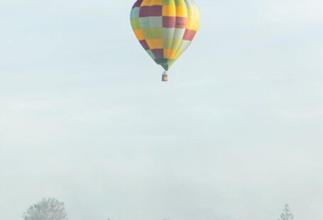Hamilton - Checkered Hot Air Balloon Flying Above the Foggy City