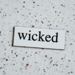 Wicked - Text on a White Surface