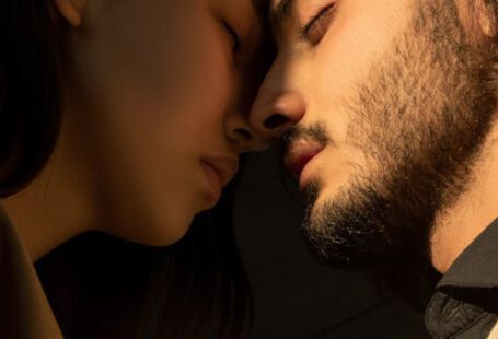 Streetcar Named Desire - Close-up Photo of Couple with Their Eyes Closed Facing Each Other In Front of Dark Background