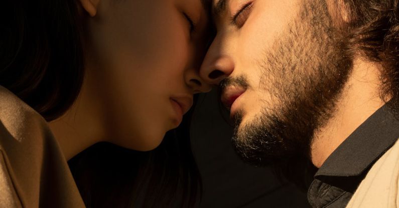 Streetcar Named Desire - Close-up Photo of Couple with Their Eyes Closed Facing Each Other In Front of Dark Background