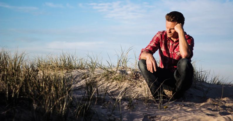 Doubt - Shallow Focus Photography of Man Wearing Red Polo Shirt