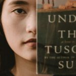 Under The Tuscan Sun - Woman Holding Under the Tuscan Sun Book