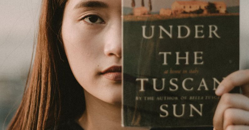 Under The Tuscan Sun - Woman Holding Under the Tuscan Sun Book